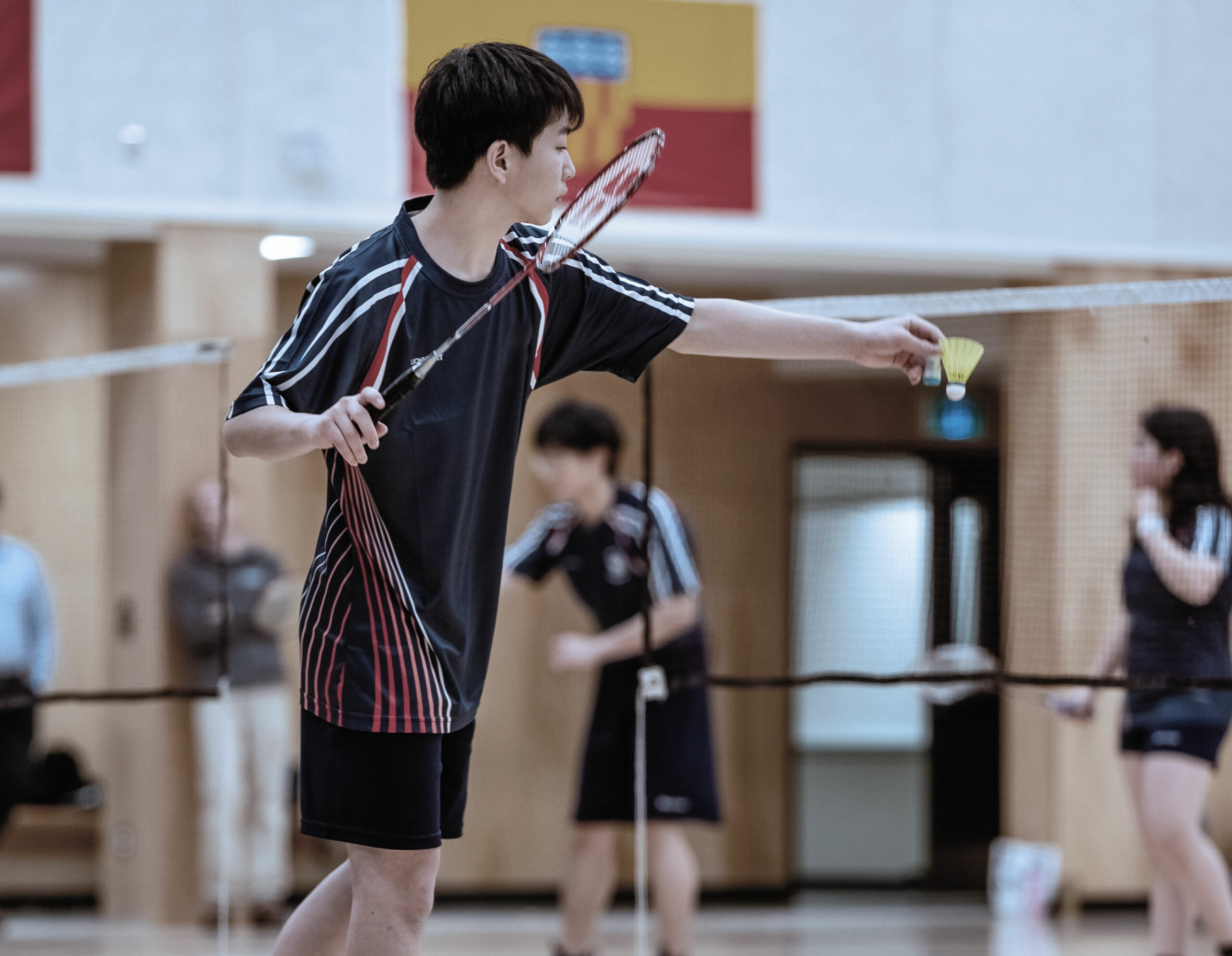 Student playing badminton