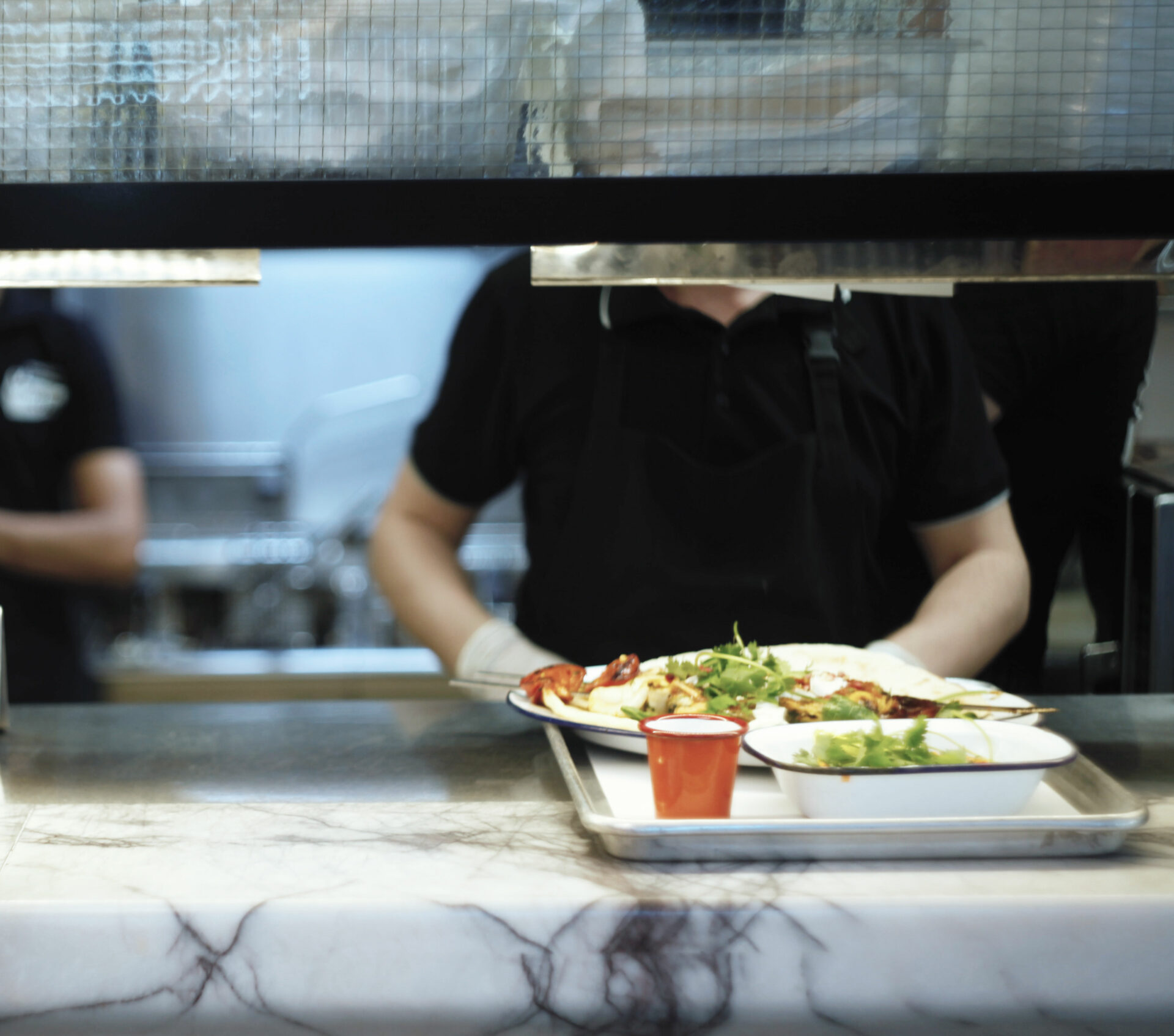 Cafeteria worker serving food